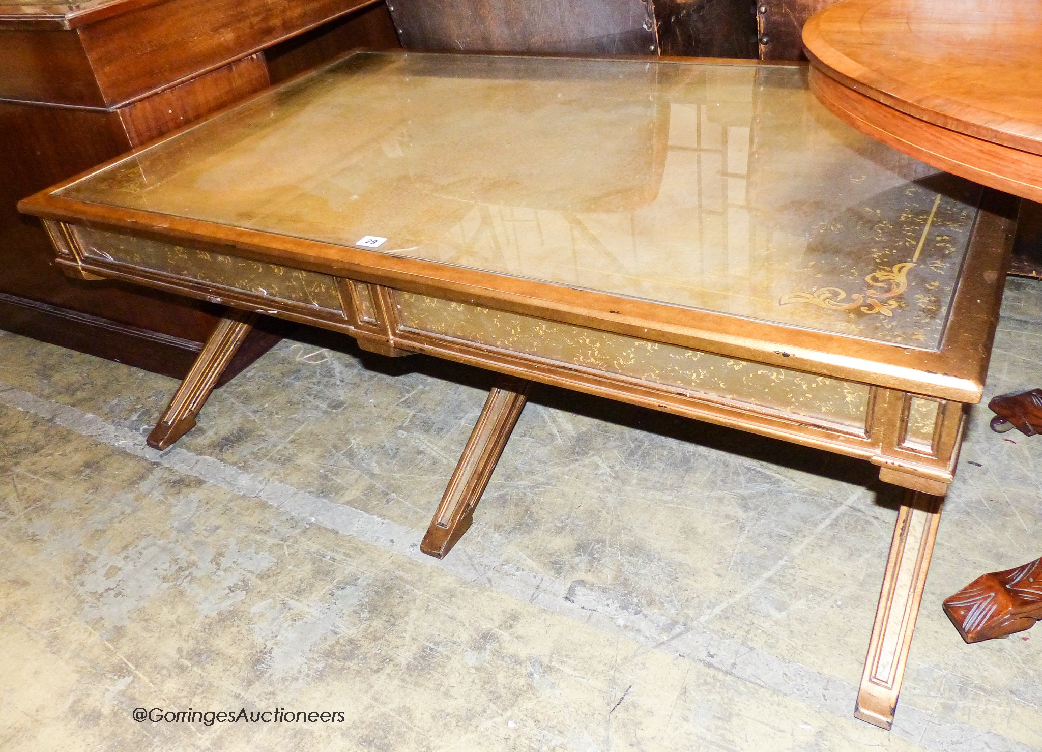 An Italian style gilt and glass 'X' frame coffee table fitted end drawers, length 132cm, depth 80cm, height 51cm